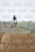 WHITE BIKE WITH PINK NUMBER PLATE - BLACK GREY FLUO GREEN FOX SUIT WITH FLUO YELLOW GREEN TEAL PANTS - BLACK GREY HELMET · DSH_0685