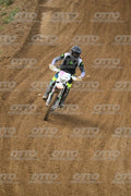 WHITE BIKE WITH PINK NUMBER PLATE - BLACK GREY FLUO GREEN FOX SUIT WITH FLUO YELLOW GREEN TEAL PANTS - BLACK GREY HELMET · DSH_0690