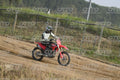 HONDA CRF RED - WHITE BLACK SUIT WITH BLACK PANTS - BLACK WHITE GREEN HELMET WITH MONSTER GRAPHICS · DSH_1716