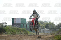 HONDA CRF RED - WHITE BLACK SUIT WITH BLACK PANTS - BLACK WHITE GREEN HELMET WITH MONSTER GRAPHICS · DSH_1800