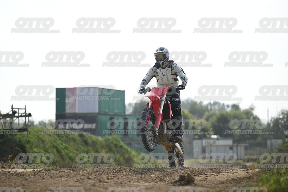 HONDA CRF RED - WHITE BLACK SUIT WITH BLACK PANTS - BLACK WHITE GREEN HELMET WITH MONSTER GRAPHICS · DSH_1800