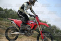 HONDA CRF RED - WHITE BLACK SUIT WITH BLACK PANTS - BLACK WHITE GREEN HELMET WITH MONSTER GRAPHICS · DSH_1913