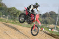 HONDA CRF RED - WHITE BLACK SUIT WITH BLACK PANTS - BLACK WHITE GREEN HELMET WITH MONSTER GRAPHICS · DSH_1925