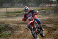 BETA RR RED WHITE BLUE - RED BLACK FXR SUIT WITH BLUE PANTS - WHITE RED HELMET WITH GREEN GOGGLES · DSH_2400