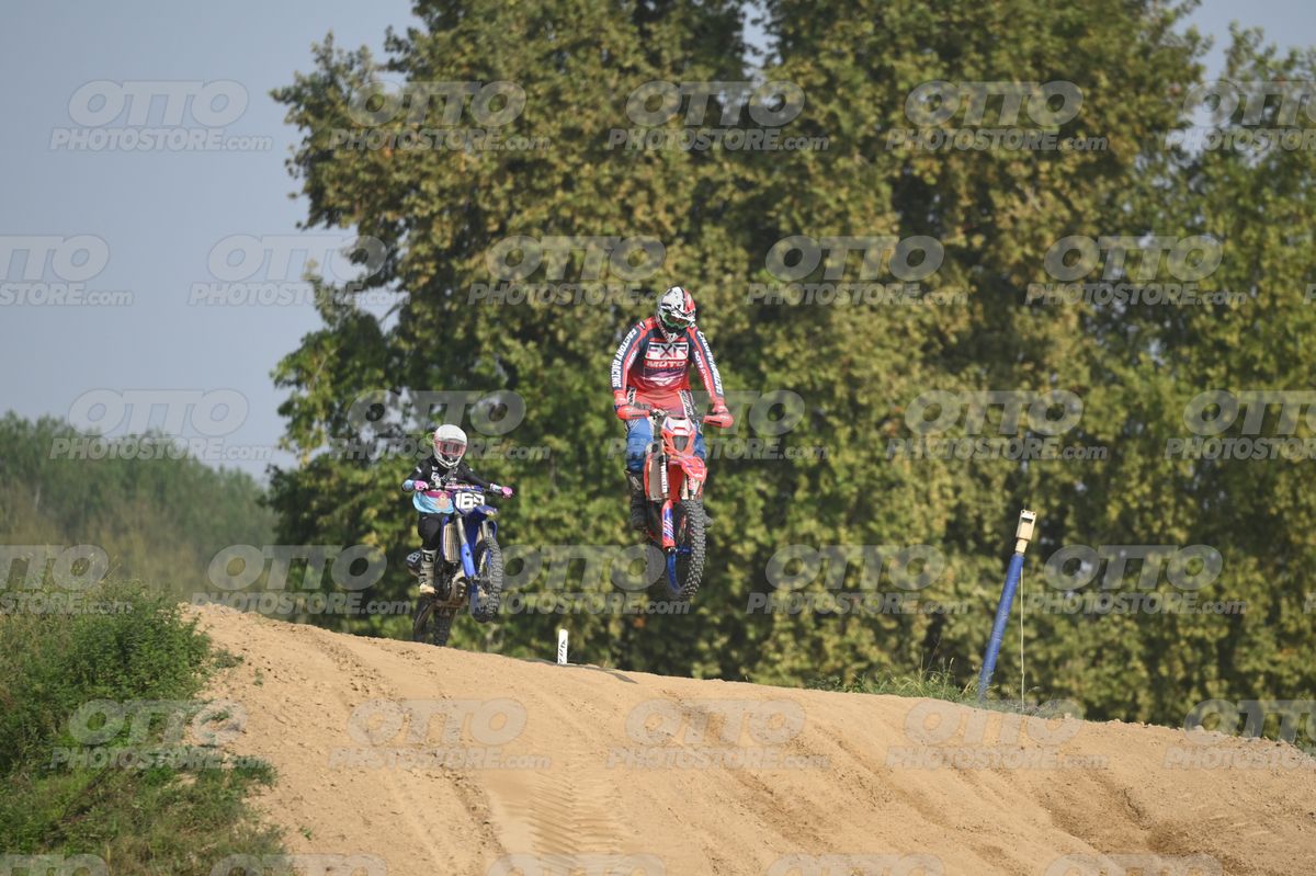 BETA RR RED WHITE BLUE - RED BLACK FXR SUIT WITH BLUE PANTS - WHITE RED HELMET WITH GREEN GOGGLES · DSH_3062