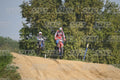 BETA RR RED WHITE BLUE - RED BLACK FXR SUIT WITH BLUE PANTS - WHITE RED HELMET WITH GREEN GOGGLES · DSH_3063