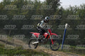 HONDA CRF RED - WHITE BLACK SUIT WITH BLACK PANTS - BLACK WHITE GREEN HELMET WITH MONSTER GRAPHICS · DSH_3201