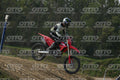 HONDA CRF RED - WHITE BLACK SUIT WITH BLACK PANTS - BLACK WHITE GREEN HELMET WITH MONSTER GRAPHICS · DSH_3205