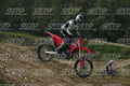 HONDA CRF RED - WHITE BLACK SUIT WITH BLACK PANTS - BLACK WHITE GREEN HELMET WITH MONSTER GRAPHICS · DSH_3207