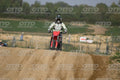 HONDA CRF RED - WHITE BLACK SUIT WITH BLACK PANTS - BLACK WHITE GREEN HELMET WITH MONSTER GRAPHICS · DSH_3212